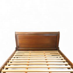 Late 20th century French design mahogany king size sleigh bed, the shaped headboard and footboard with scroll carved terminals and panelled fields, over swept side rails, raised on moulded bracket supports