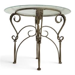 Wrought metal and glass table, with silvered foliate and scrolled design