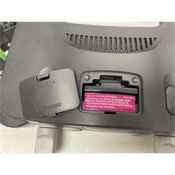 Nintendo 64 console, two controllers, games and accessories. Accessories to include the ‘Tremorpak’ and ‘Spook’ 2 Phono plugs and a S-VHS plug with adapter, both in original boxes. Games to include ‘Golden Eye 007’, ‘Doom 64’, ‘Killer Instinct Gold’, ‘Tetrisphere’, ‘F-1 World Grand Prix’, ‘Pilotwings 64’ and ‘Lylatwars’ with ‘Rumble Pak’, all with original boxes and instruction manuals. ‘Star Wars Episode I Racer’ game cartridge in Shadows of the Empire box. 
