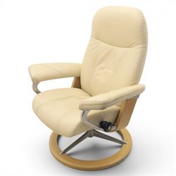 Ekornes - Stressless reclining beige leather armchair and stool, raised on brushed steel frame, light oak rotating base