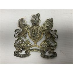 Victorian Volunteer Medical Staff Corps white metal helmet plate in the form of Victorian crowned Royal Arms with three part lower scroll for “VOLUNTEER MEDICAL STAFF CORPS”; three lug fittings to the reverse L8.5cm