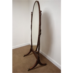  Edwardian inlaid mahogany Cheval mirror, with oval plate on ring turned supports, four sabre legs with square brass sockets and castors, H174cm, W66cm   