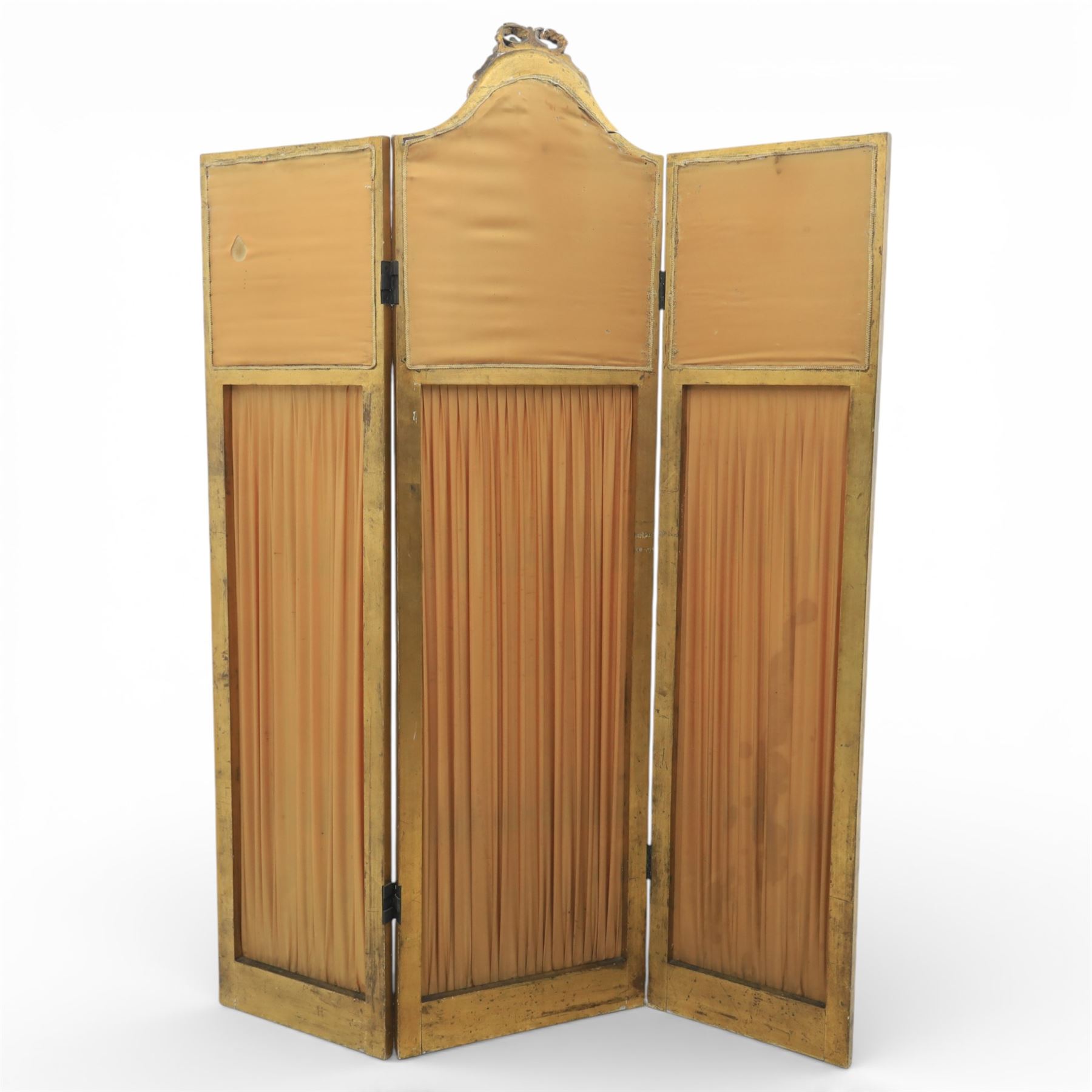 Late 19th century French Louis XIV style giltwood three fold dressing screen, each panel upholstered in floral fabric within fluted borders, with mirrored panels to tops set within moulded frames with foliate and ribbon swags 
