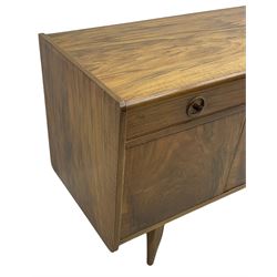 Mid-20th century figured walnut sideboard, fitted with seven drawers and two double cupboards, on tapering supports 