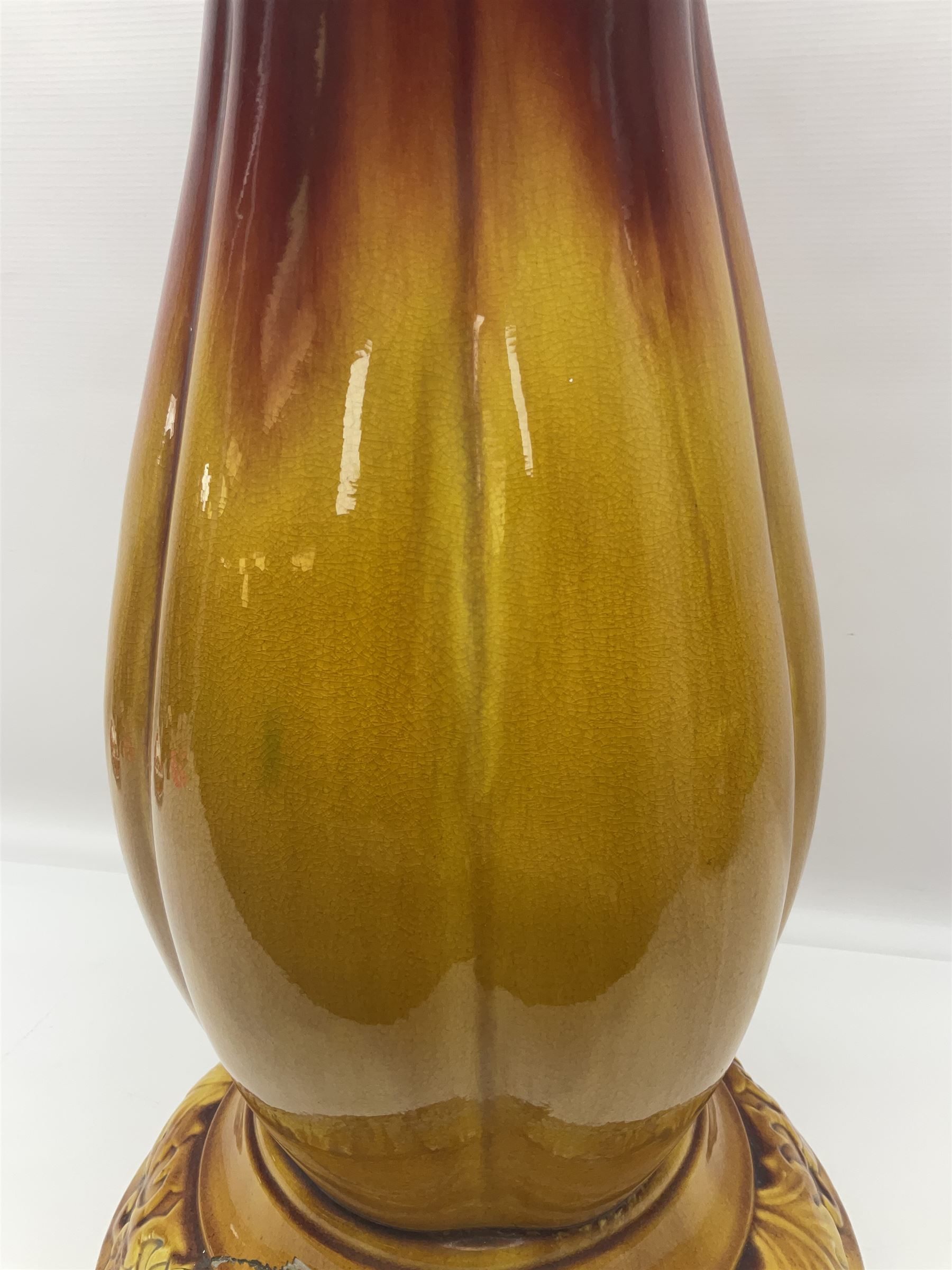 Bretby Jardiniere and stand, with foliate and foliage decoration with a red and yellow ground, impressed mark beneath H94cm