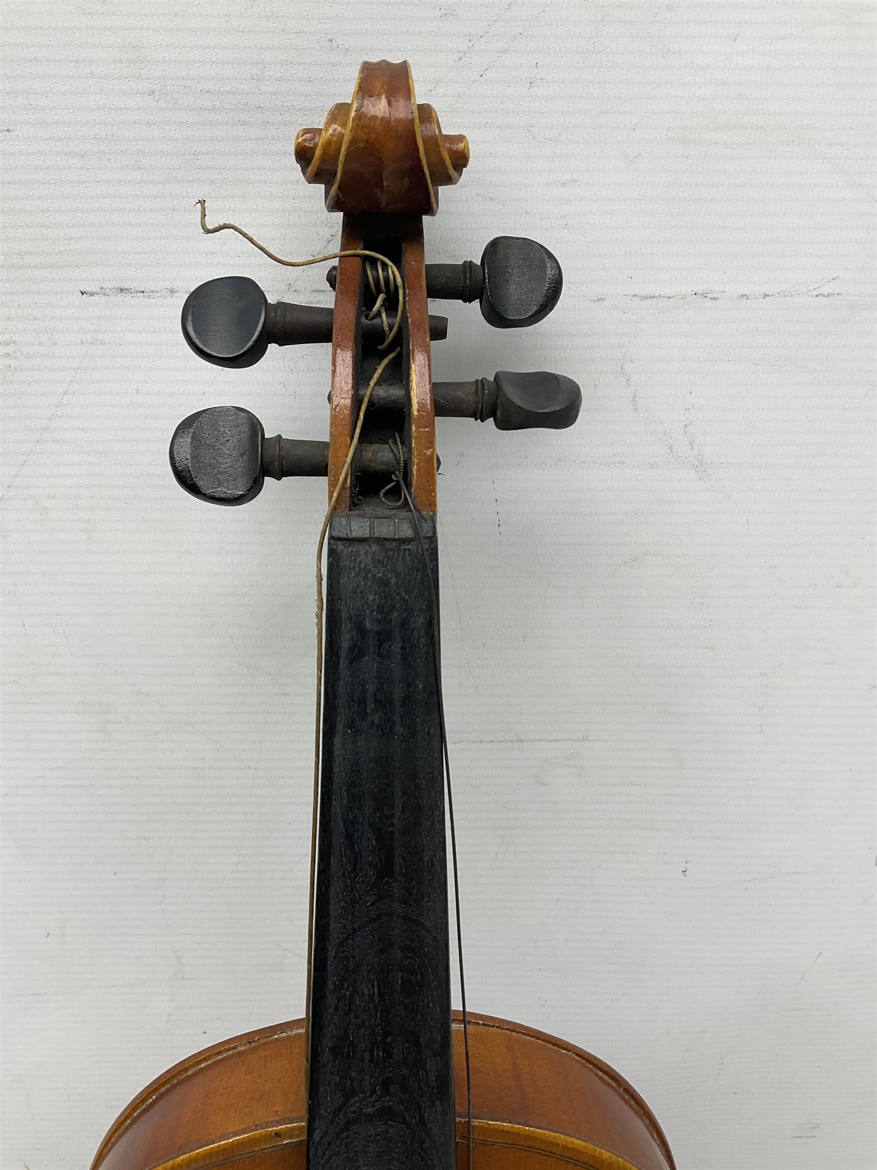 Czechoslovakian violin c1920 with 36cm two-piece maple back and ribs and spruce top, bears label 'Copy of Antonius Stradivarius Made in Czechoslovakia' L59cm; in carrying case; 1950s Czechoslovakian violin; and 195os Czechoslovakian three-quarter size violin; both cased (3)