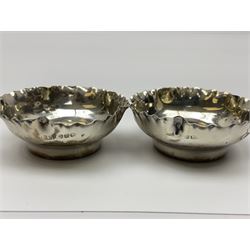 Pair of Victorian silver open salts, of circular form with shaped rims and matching salt spoons, all hallmarked, within fitted tooled leather case 