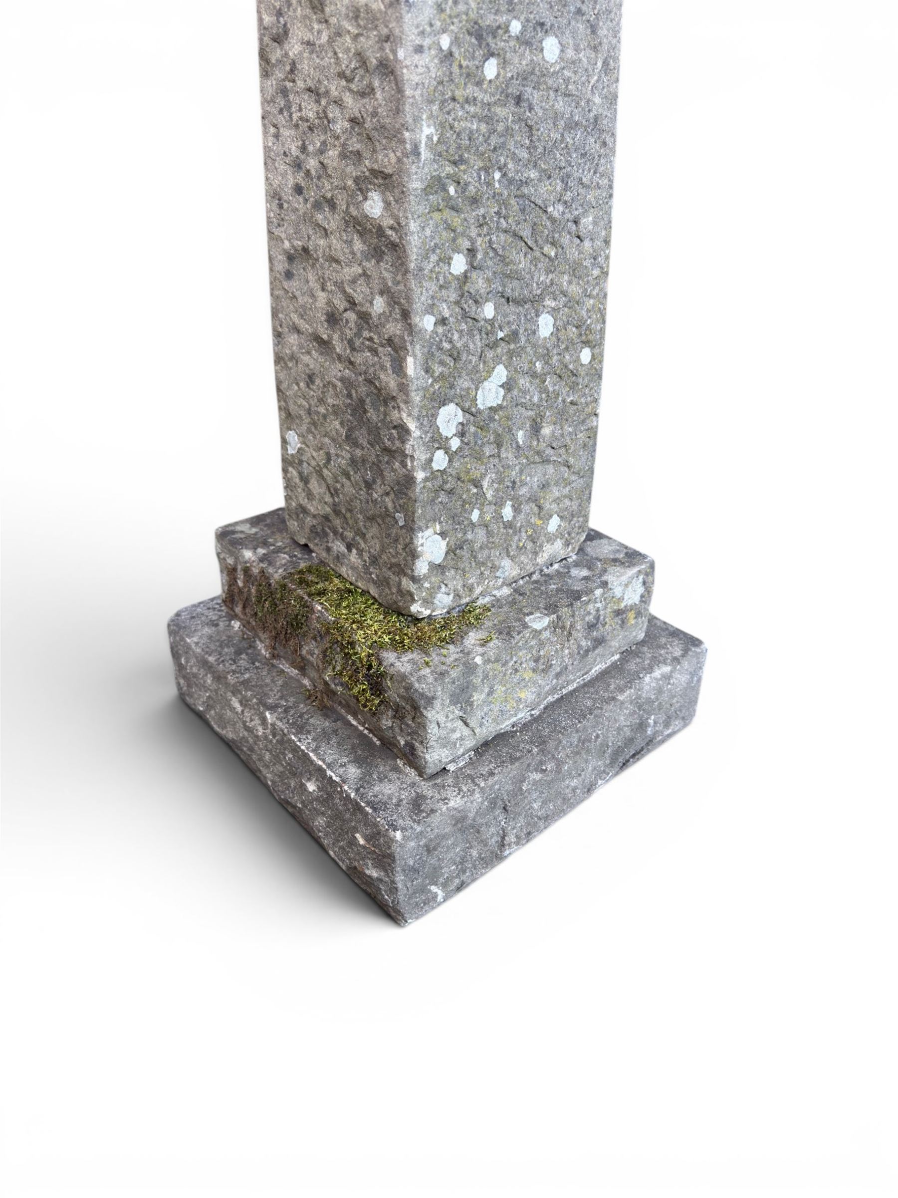 19th century weathered sandstone birdbath, formed in four sections, square top with carved shell bath, raised on tapering column with stepped base