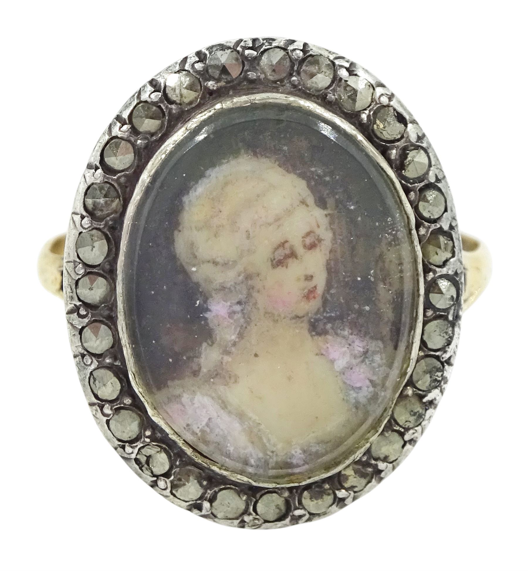 19th century French 18ct gold and silver marcasite portrait ring, set with an oval miniature of a woman on ivory, under glazed panel, with marcasite surround and trifurcated shoulders, hallmarked. This lot has been registered for sale under Section 10 of the APHA Ivory Act