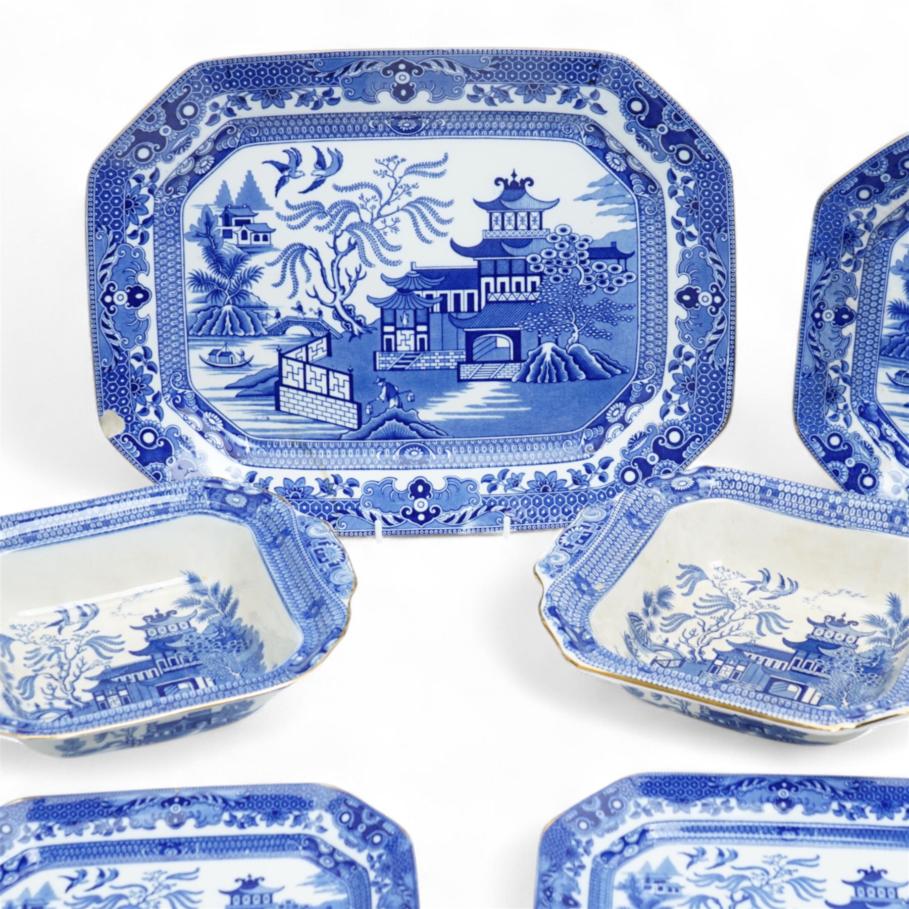 Large collection of Burleigh Ware blue and white Willow pattern dinnerware, comprising twenty one dinner plates, twelve side plates, four platters of graduating size, two tureens with saucers, and two vegetable dishes