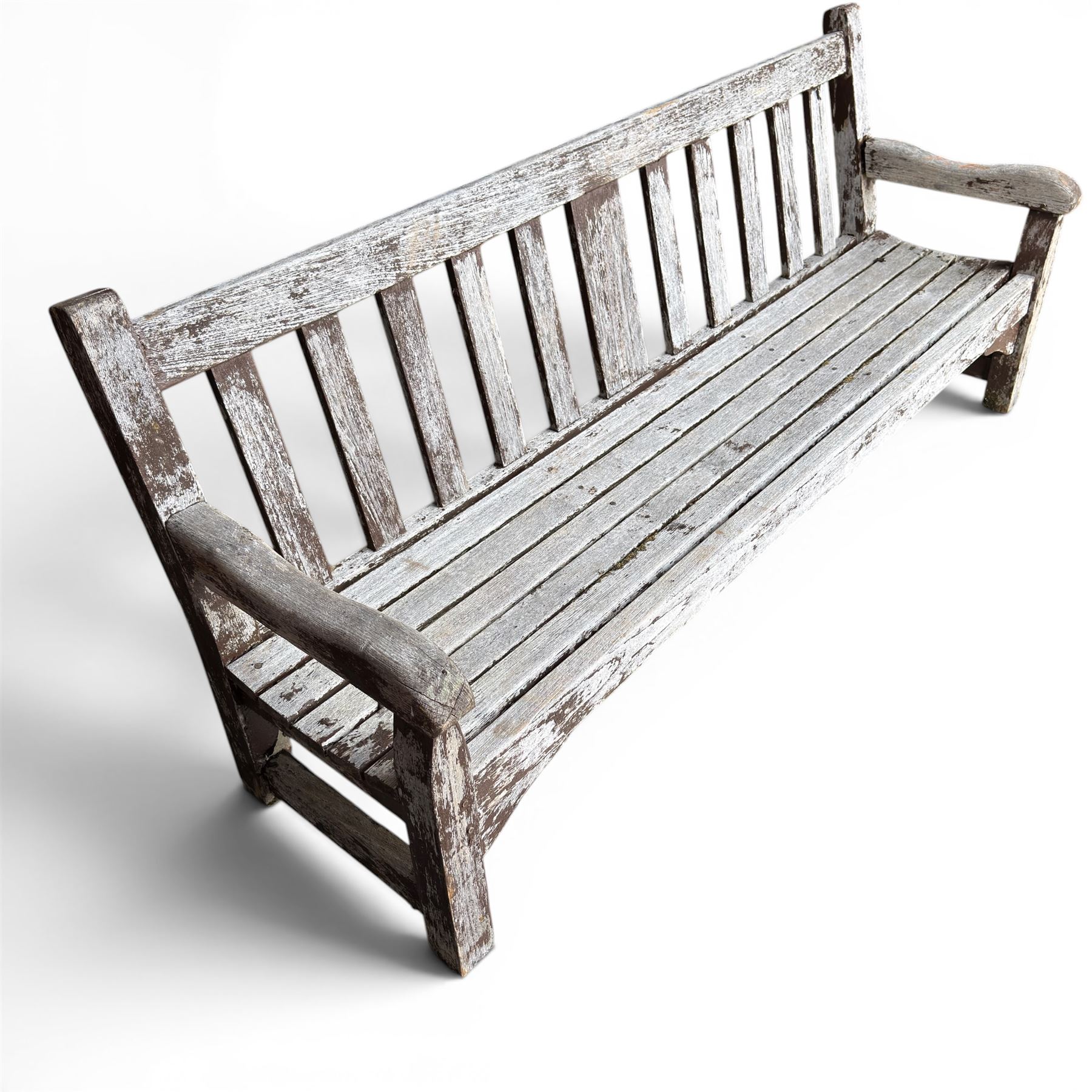 Teak garden bench with slatted back and seat on square supports in weathered which finish 