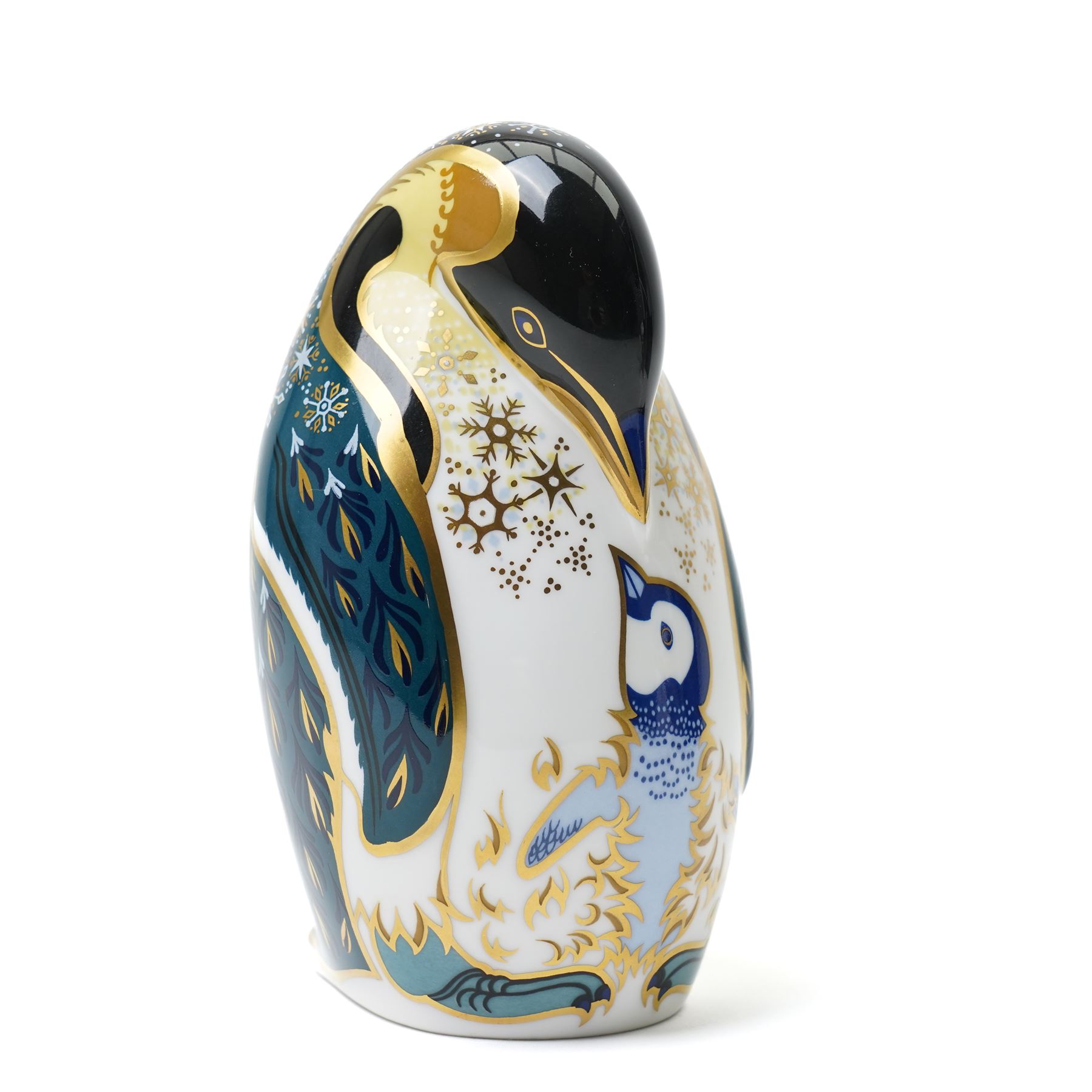 Three Royal Crown Derby paperweights, comprising Puffin with gold stopper, Rockhopper penguin with gold stopper, and Penguin and Chick with gold stopper, two with boxes (3)
