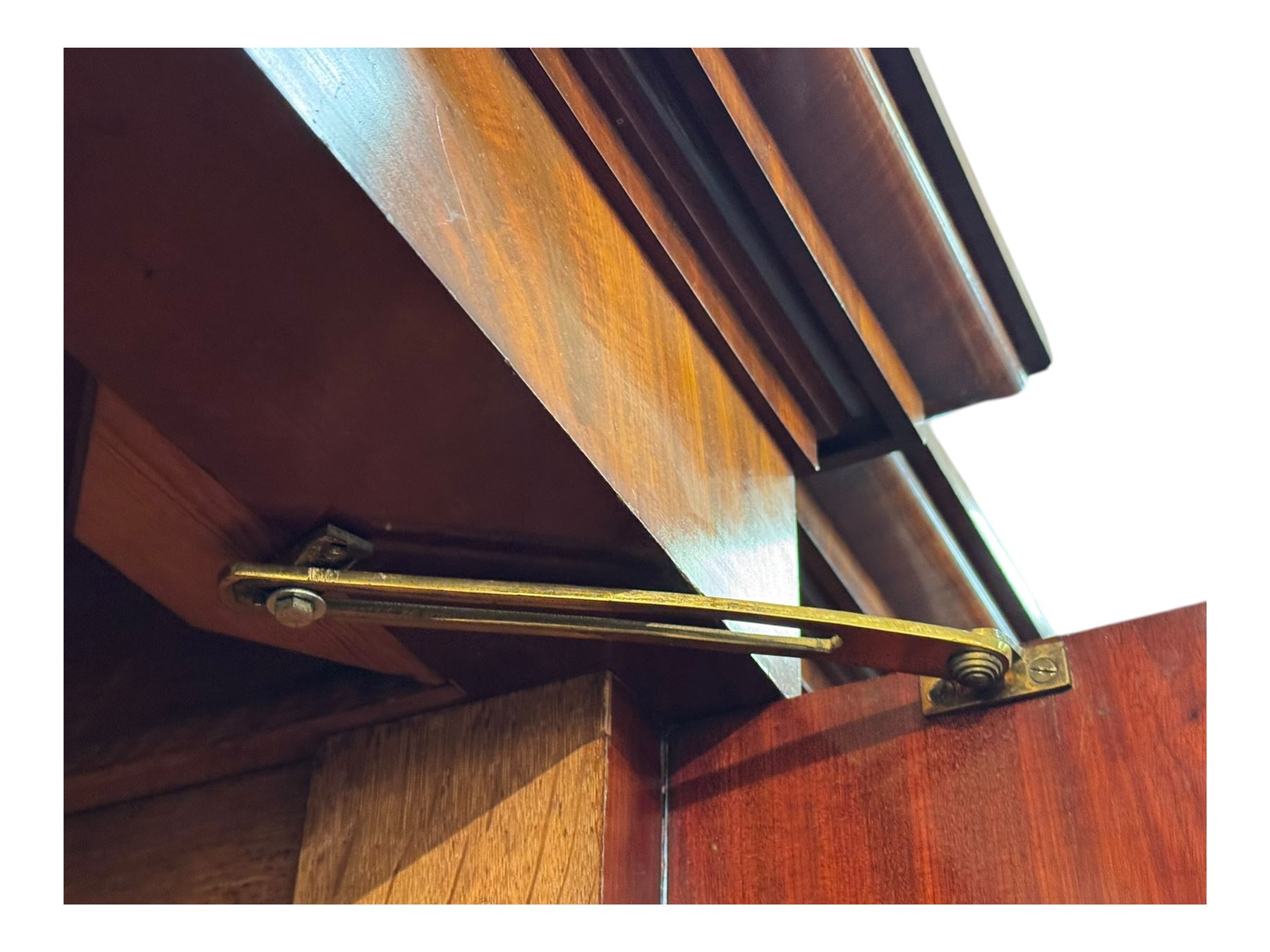 19th century mahogany break-fronted quadruple wardrobe, stepped and moulded projecting cornice over four arch panelled doors, moulded plinth base on blocks 