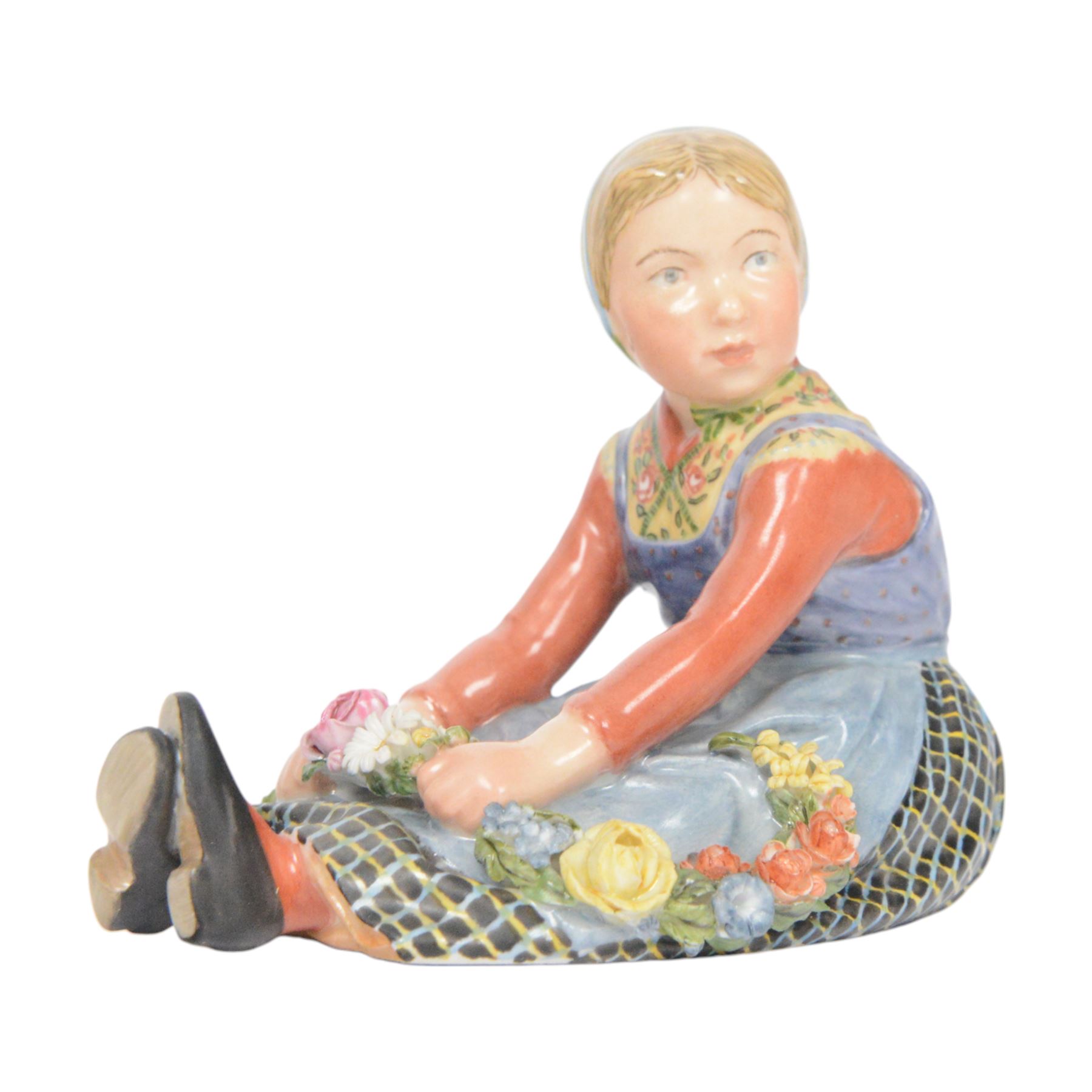Royal Copenhagen figure, Jutland girl, designed by Carl Martin Hansen, from the Danish National Costumes series, of a girl with a flower garland, marked beneath, H8cm 