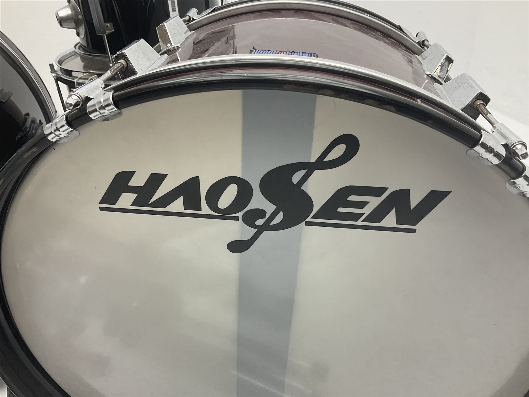 Rockburn eight-piece black drum kit with bass drum, floor tom and five other toms and snare drum; together with two other snare drums; Haosen bass drum; four cymbals; various stands, foot pedals, stool, tri-angle, drum sticks etc