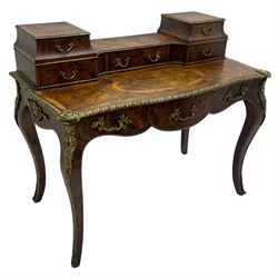 Late 19th to early 20th century French figured walnut writing desk, raised back fitted with drawers, shaped top with Kingwood banding and foliage cast edge moulding, fitted with single drawer, on cabriole supports mounted by shell and flower head cartouches 