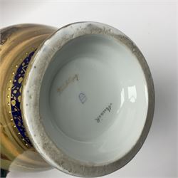 19th century Vienna style porcelain 'Musik' garniture, the central vase of baluster form with domed cover flanked by two smaller vases with twin curved gilt handles to short neck, each decorated with classical figural vignettes between blue borders heightened with gilt, H33.5cm