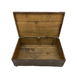 Early 19th century oak low blanket chest, metal strapped and bound, two carrying handles to either end, on castors