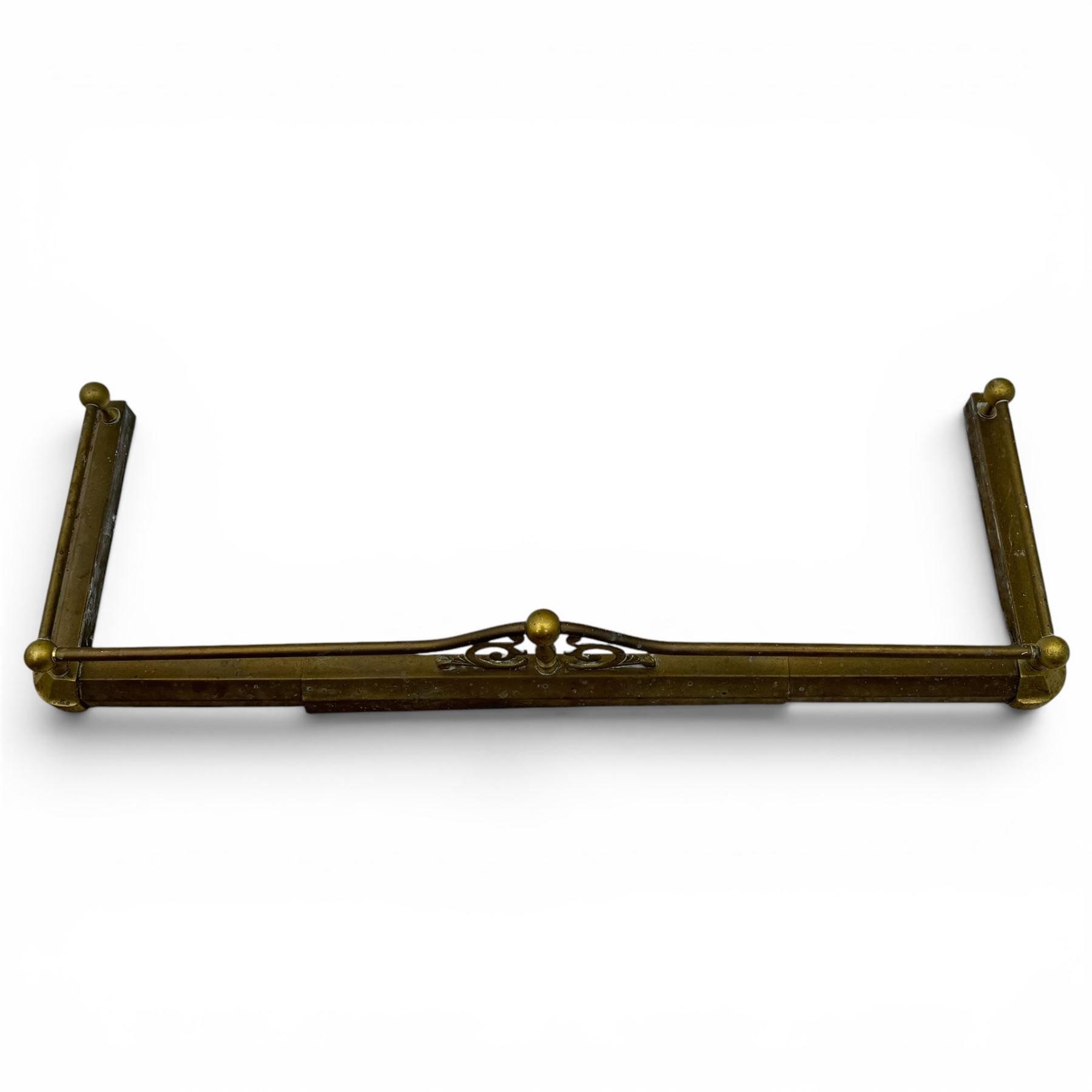 Three 20th century brass fenders, two with pierced Art & Crafts design rails, largest W156cm, D 45cm 