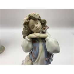 Three Lladro figures, comprising, Dreams of Summer Past no 6401, Spring Breeze no 4936 and Breezy Afternoon 5682 together with Lladro plaque Art Brings us Together no 7677, all in original boxes, largest example H35cm