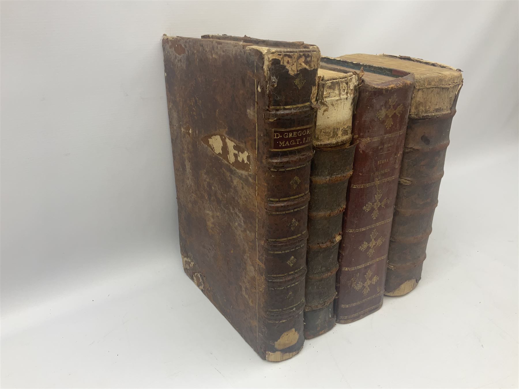 Sancti Gregorii Magni Papae Primi Opera , Sixti V Pont Max Iussu .... 1640 Paris. Two volumes in one with engraved galleon to each title page; R.P. Joan. Stephani Menochij Doctoris Theologi E Societate Jesu .... Editio Novissima .... Tomus Primus. 1683 Lugduni Francisci Comba; and two other similar leather bound folio volumes lacking title pages (4)