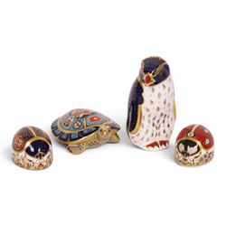 Four Royal Crown Derby paperweights, comprising Terrapin gold stopper, Rockhopper penguin ...