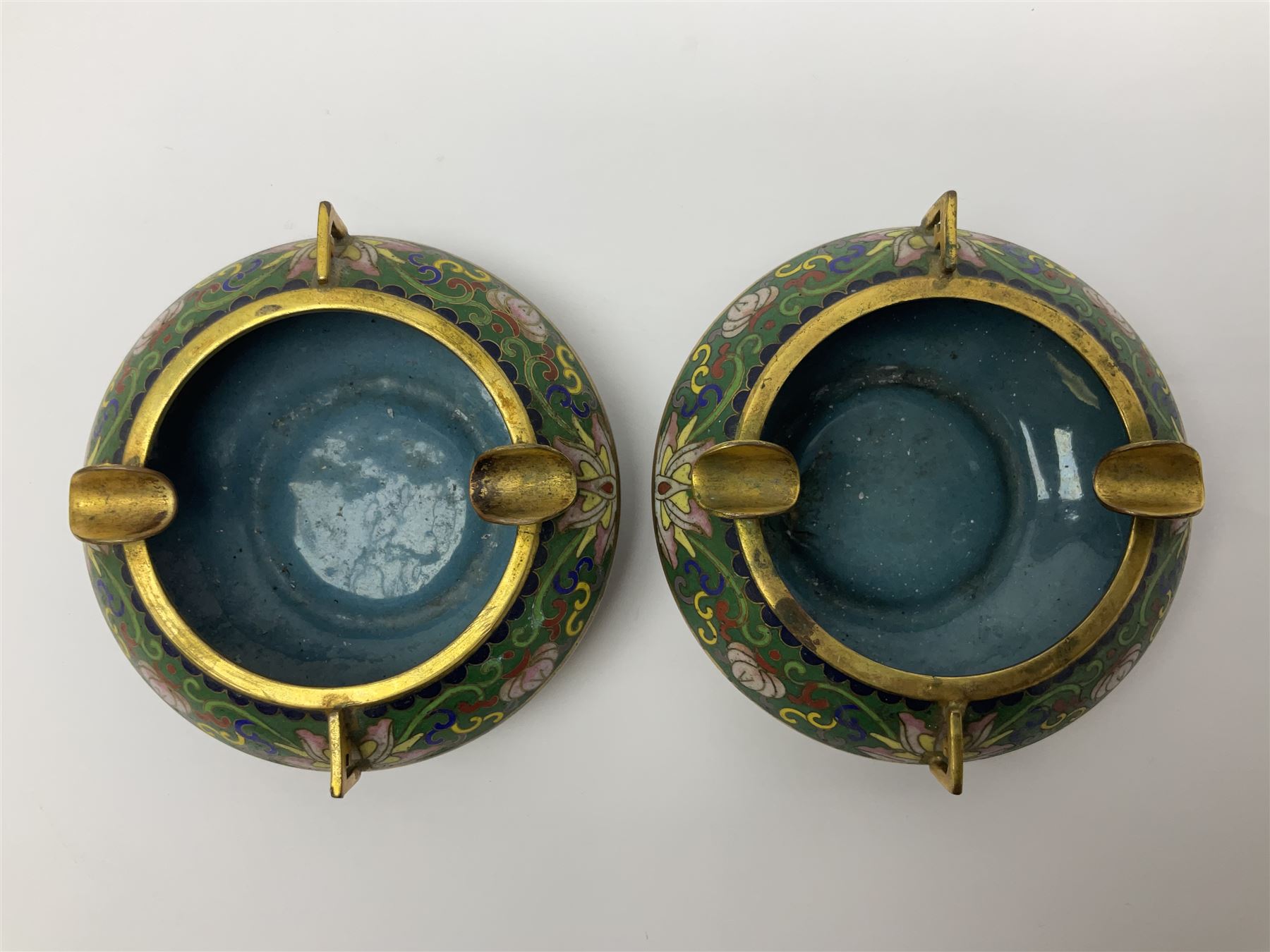 20th century Chinese cloisonne enamel smoking set, comprising two ashtrays, box and tray, with floral and foliate scrolling on green ground