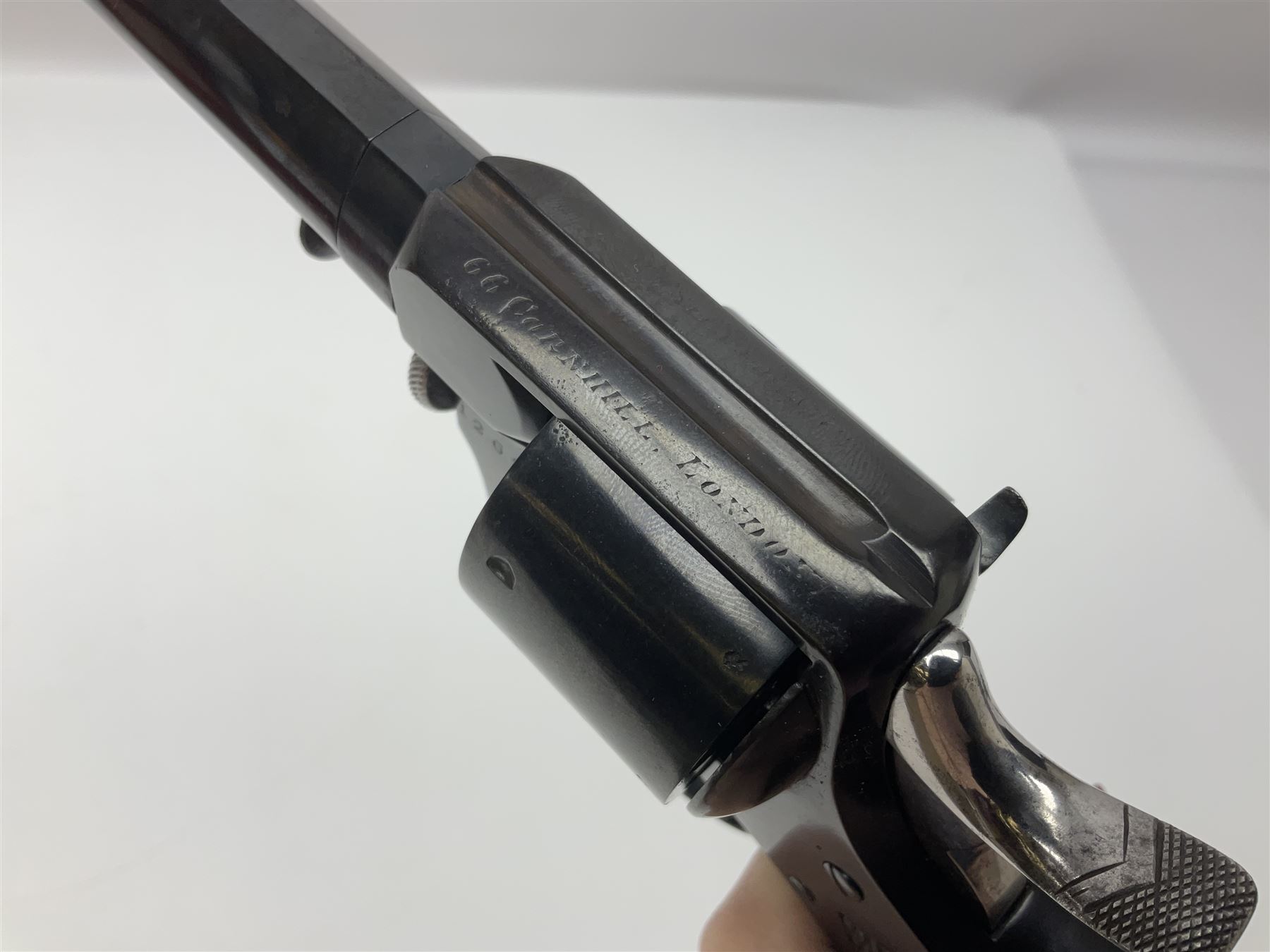 Scarce Webley & Scott .430 short six-shot revolver retailed by S.W. Silver & Co of Cornhill, London; round barrel with captive swivel ejector under; chequered walnut one-piece grip; numbered 12627 with various maker's marks L26cm overall; in fitted oak case with trade label to lid, cleaning rod, screw-driver and oil bottle