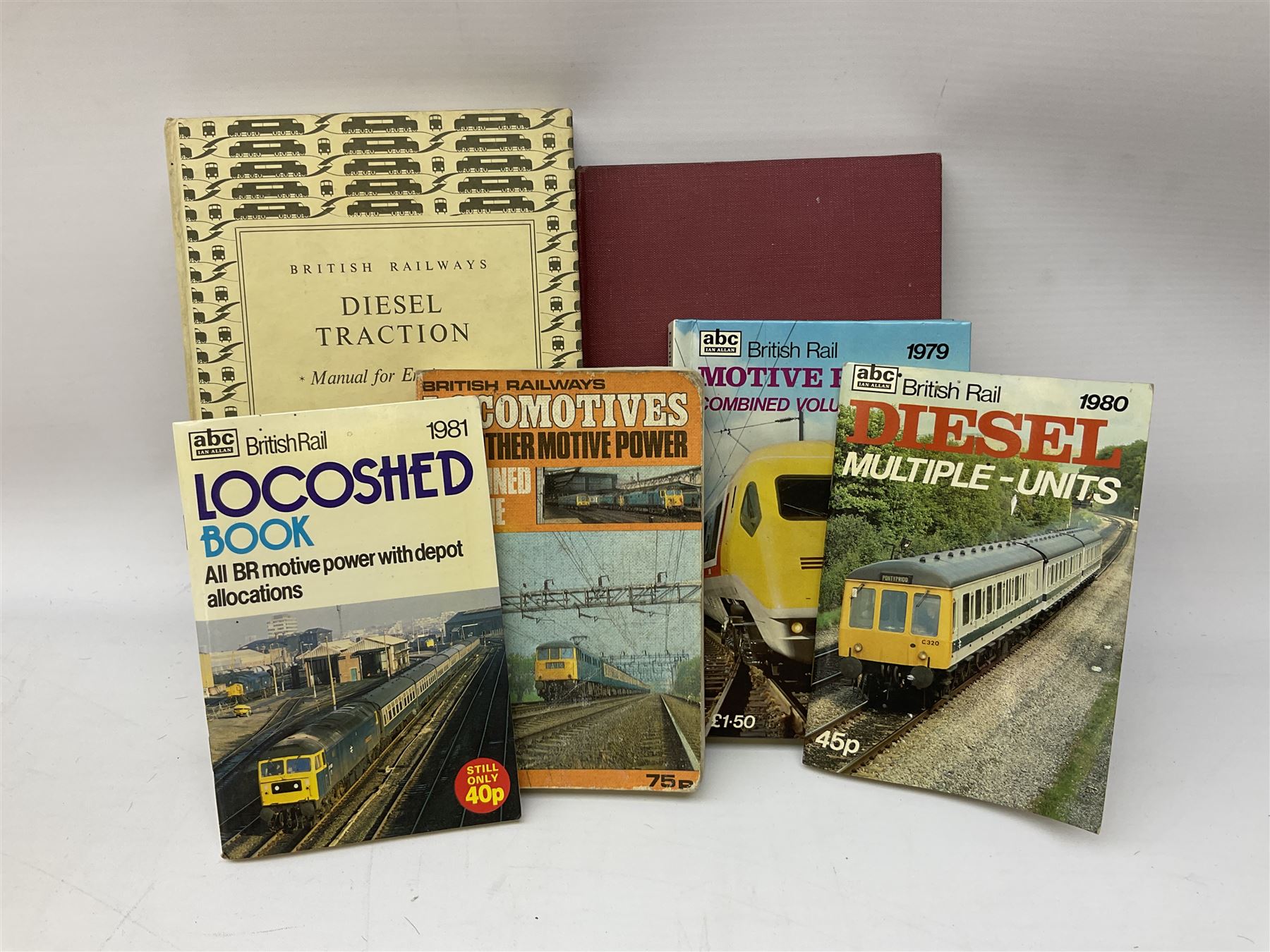 Black painted three colour railway lamp with revolving filters, H29cm; BR Acme Thunderer whistle; three railway peaked caps, two with BR Intercity 125 badge; small album of photographs of railway interest etc