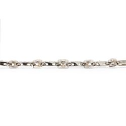 18ct white gold diamond necklace, bezel set with a single round brilliant cut diamond, spaced by two further diamonds, to a rectangular link necklace, London 2000, total diamond weight approx 0.75 carat