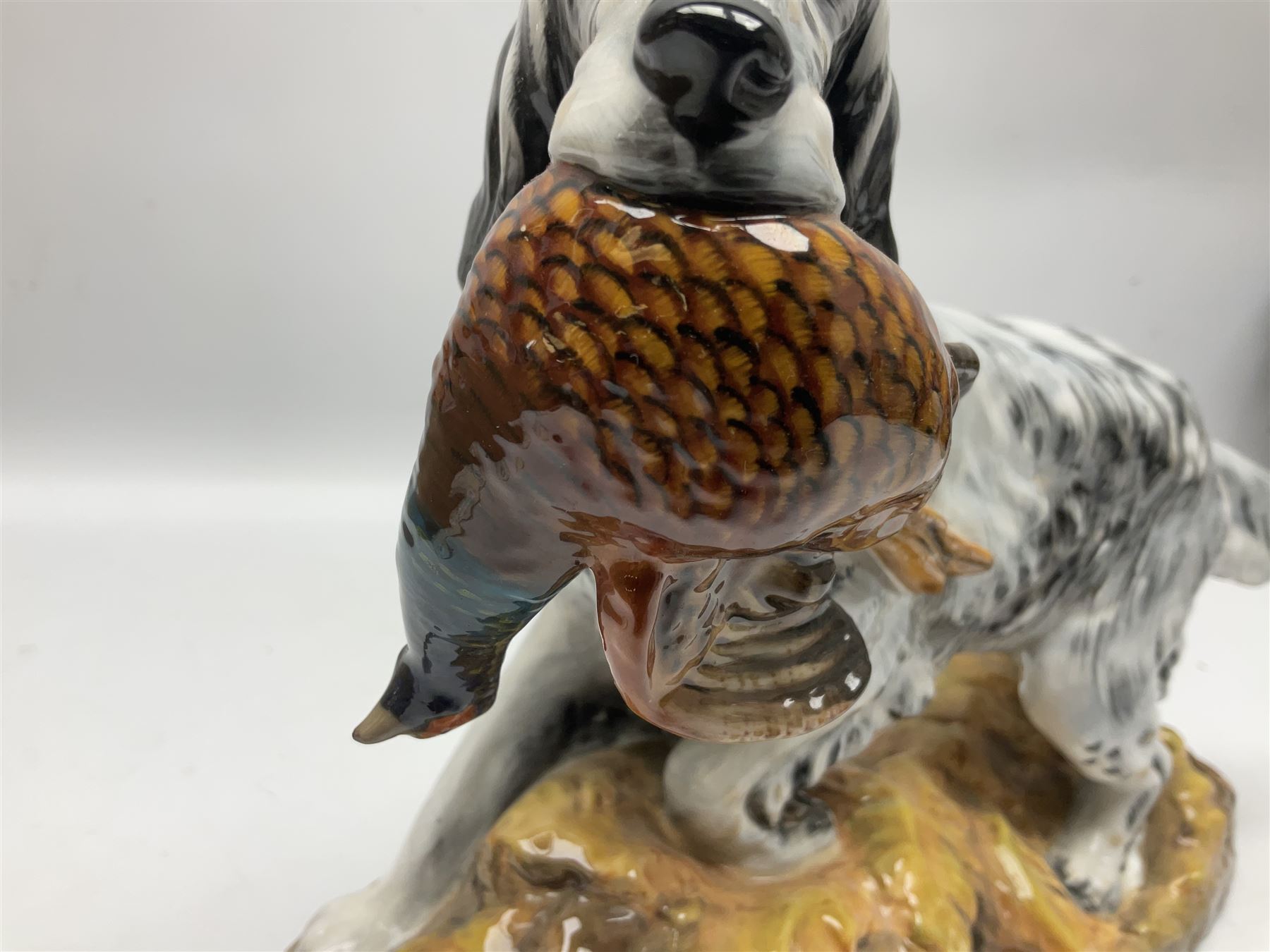 Royal Doulton model of an English setter carrying a pheasant, HN 2529, designed by Frederick Daws, H21cm