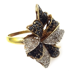  9ct gold (tested) white and black diamond flower design ring    