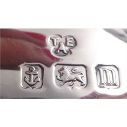 1920s silver three piece bachelors tea service, comprising teapot, cream jug and twin handled open sucrier, each of bellied form with oblique gadrooned rim, upon four bun feet, the teapot with Bakelite type handle and finial, hallmarked Thomas Edward Atkins, Birmingham 1912, teapot H13.5cm