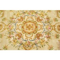 20th century French Aubusson style circular carpet, cream ground of Savonnerie design with scrolling floral and scallop motifs