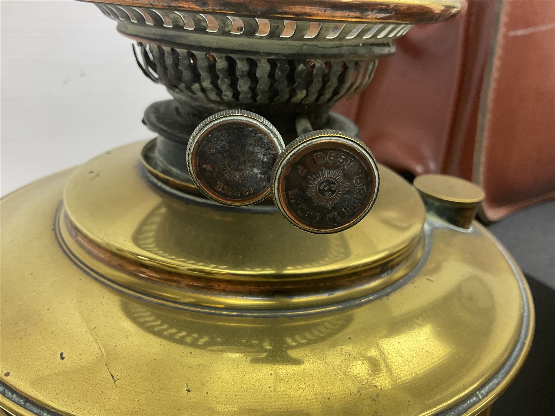 Brass oil lamp, with etched floral glass shade, leather Gladstone style doctors bag, leather satchel and vintage vanity case, three graduating wooden giraffes and other wood and metal ware, lamp H54cm