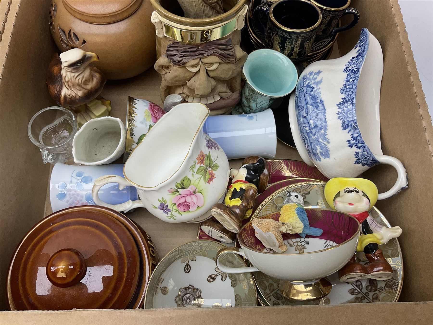 Quantity of various ceramics and glassware to include pair of Disney Mickey and Minnie Mouse cowboy Sherriff figures, stamped Japan beneath, Mason's ironstone, Wedgwood, Portmeirion, tea and dinner wares, collectors plates, glass animals etc in four boxes