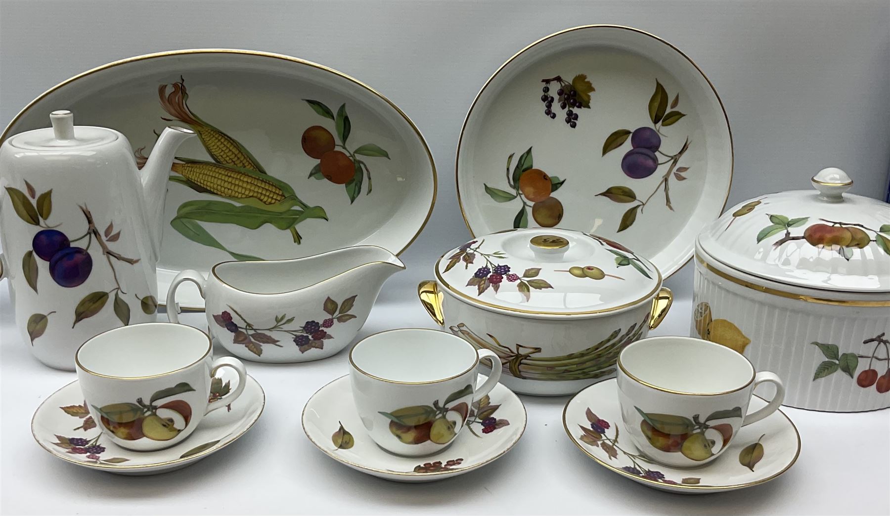 Royal Worcester Evesham pattern dinner and tea wares, comprising five tureens, seven coffee cup, ten tea cups and saucers, coffee pot, jug and various serving bowls etc, along with Royal Worcester Pastorale pattern tea ware, including ten cups and saucers, ten side plates etc.  .