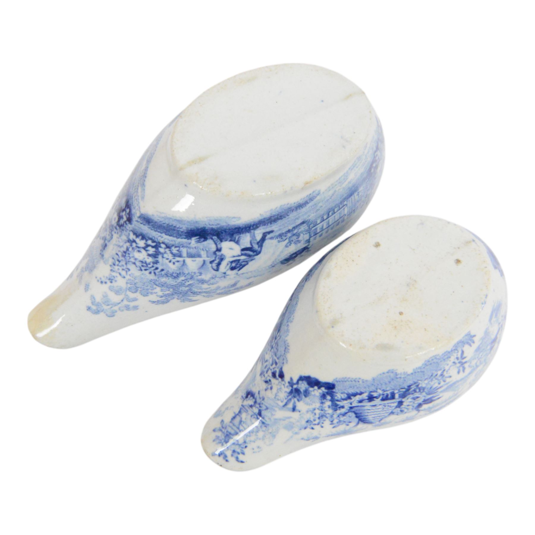 Two early 19th century blue and white transfer printed pap boats, the first example decorated in the Beehive pattern, by William Ridgeway & Co or William Adams, L10cm, the second decorated in one of the Hymphrey's Clock series patterns by William Ridgeway, L11.5cm, together with an early 19th century blue and white transfer printed invalid feeder, L17.5cm