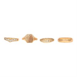 Four 9ct gold rings including cubic zirconia wishbone, all hallmarked