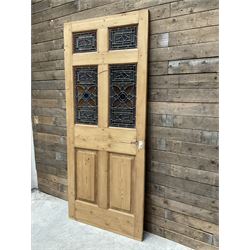 Early 20th century pine six panel door with later stained glass panels