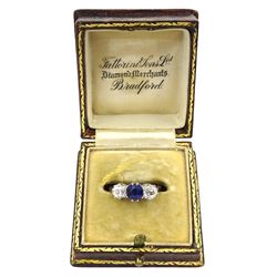 Early 20th century gold three stone old cut diamond and round sapphire ring, sapphire approx 0.60 carat, total diamond weight approx 1.00 carat