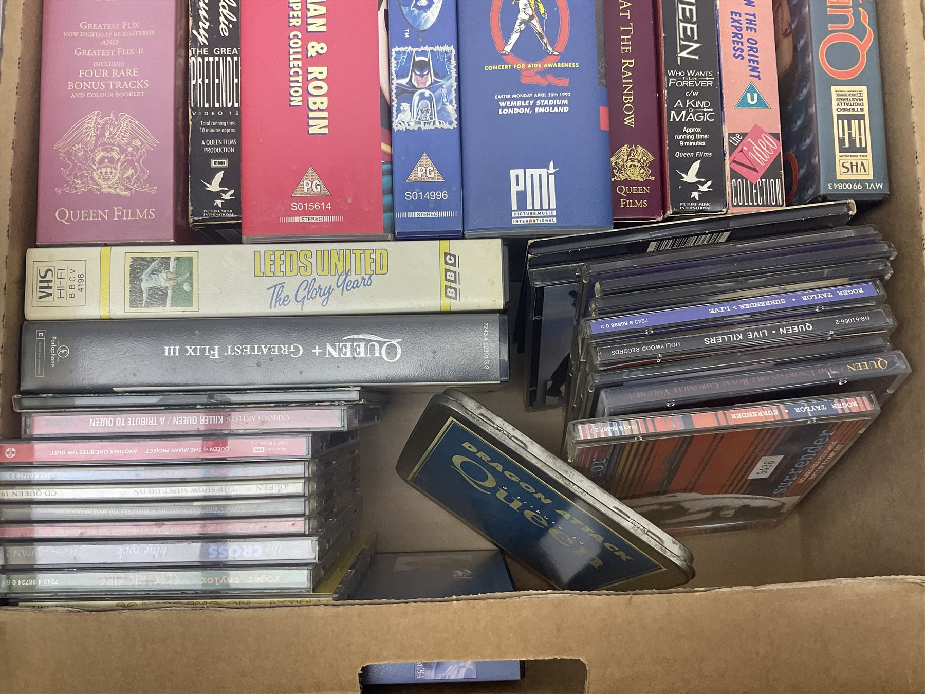Large collection of VHS tapes, DVDS, CDs to include Queen, James Bond 007, Batman etc, in three boxes