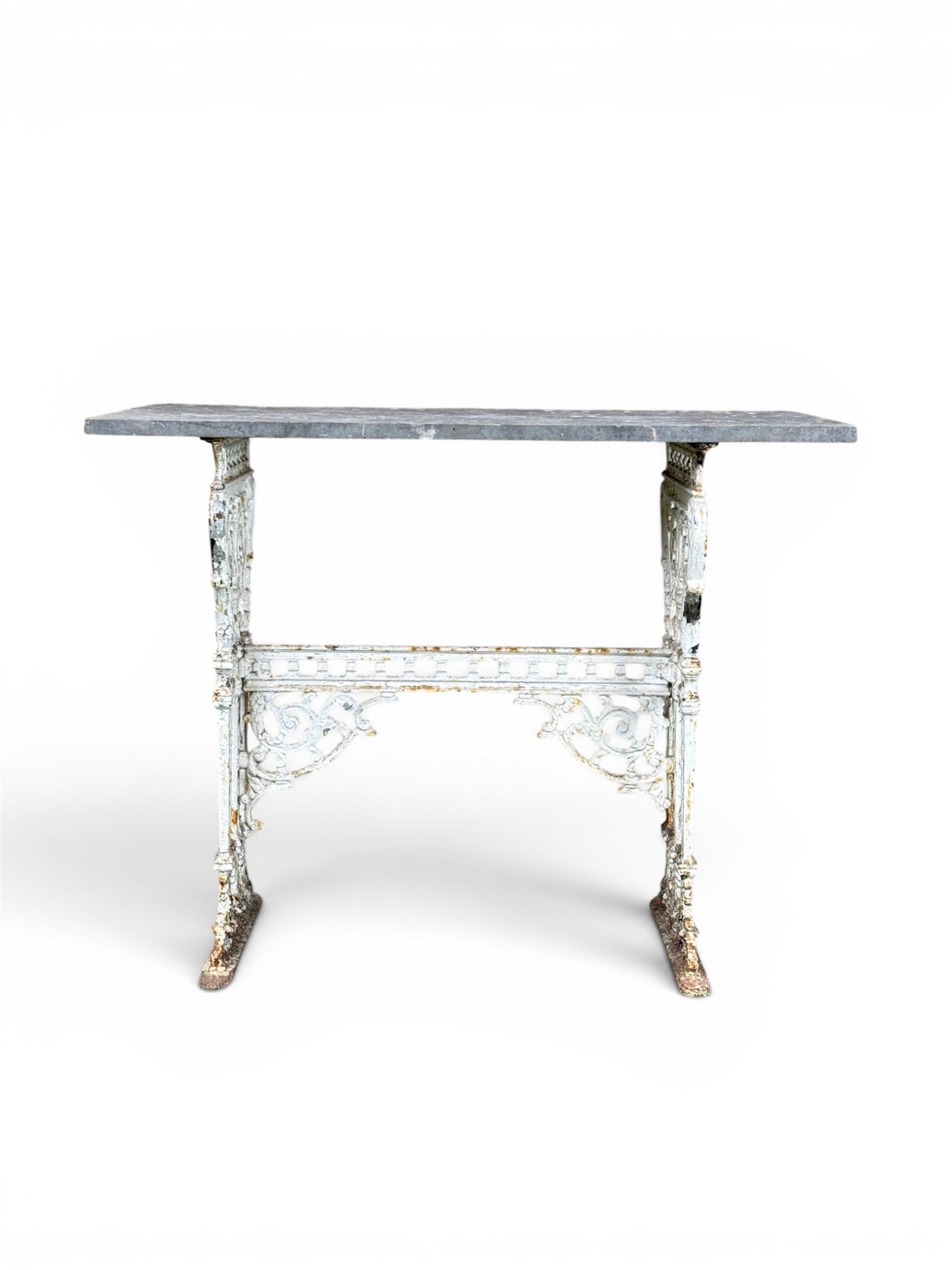 Victorian ornate cast iron garden table, trefoil base with central enclosed column, circular top with later marble, with registration mark