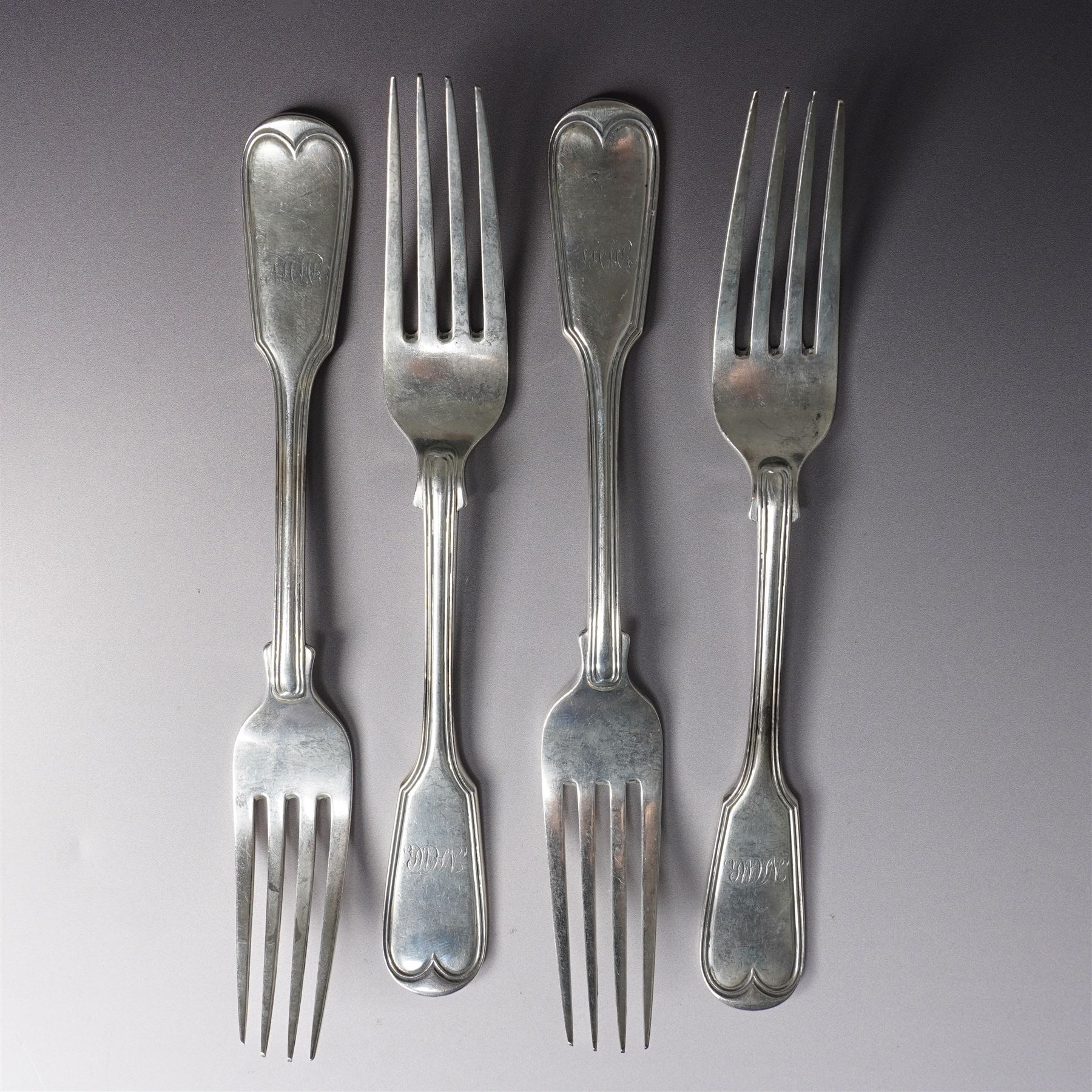 Set of four Victorian silver fiddle and thread pattern table forks engraved with a monogram London 1861 Maker The Portland Company