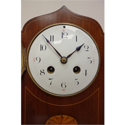  Edwardian inlaid mahogany serpentine top mantel clock with convex white Arabic dial, twin train movement half hour striking the hours on a gong, brass feet and bezel, H29cm   