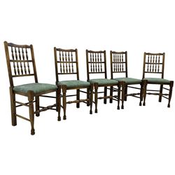 Set of five Lancashire design elm spindle back chairs, shaped cresting rail over two rows of five spindles, upholstered drop-on seats, on turned front supports united by turned stretchers  