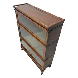 Globe Wernicke - early 20th century mahogany three-tier stacking library bookcase, three glazed sections enclosed by hinged and sliding doors, interior with transfer label, raised on cabriole front supports