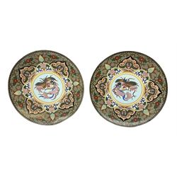 Pair of 20th century oriental cloisonné chargers, each decorated with a stylised bird on a blue ground within a decorative floral border, D30cm