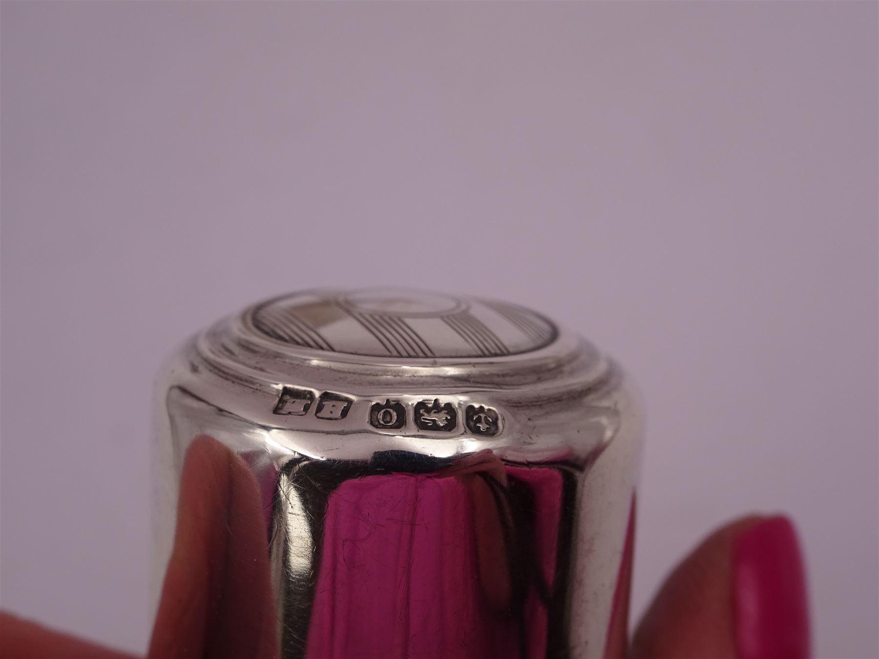 Four silver mounted glass scent bottles, including a Victorian cut glass example with embossed silver cover, and three cylindrical plain glass examples, on with engine turned decoration, three with glass stoppers, together with a pair of silver salts and spoons, all hallmarked, tallest H8cm