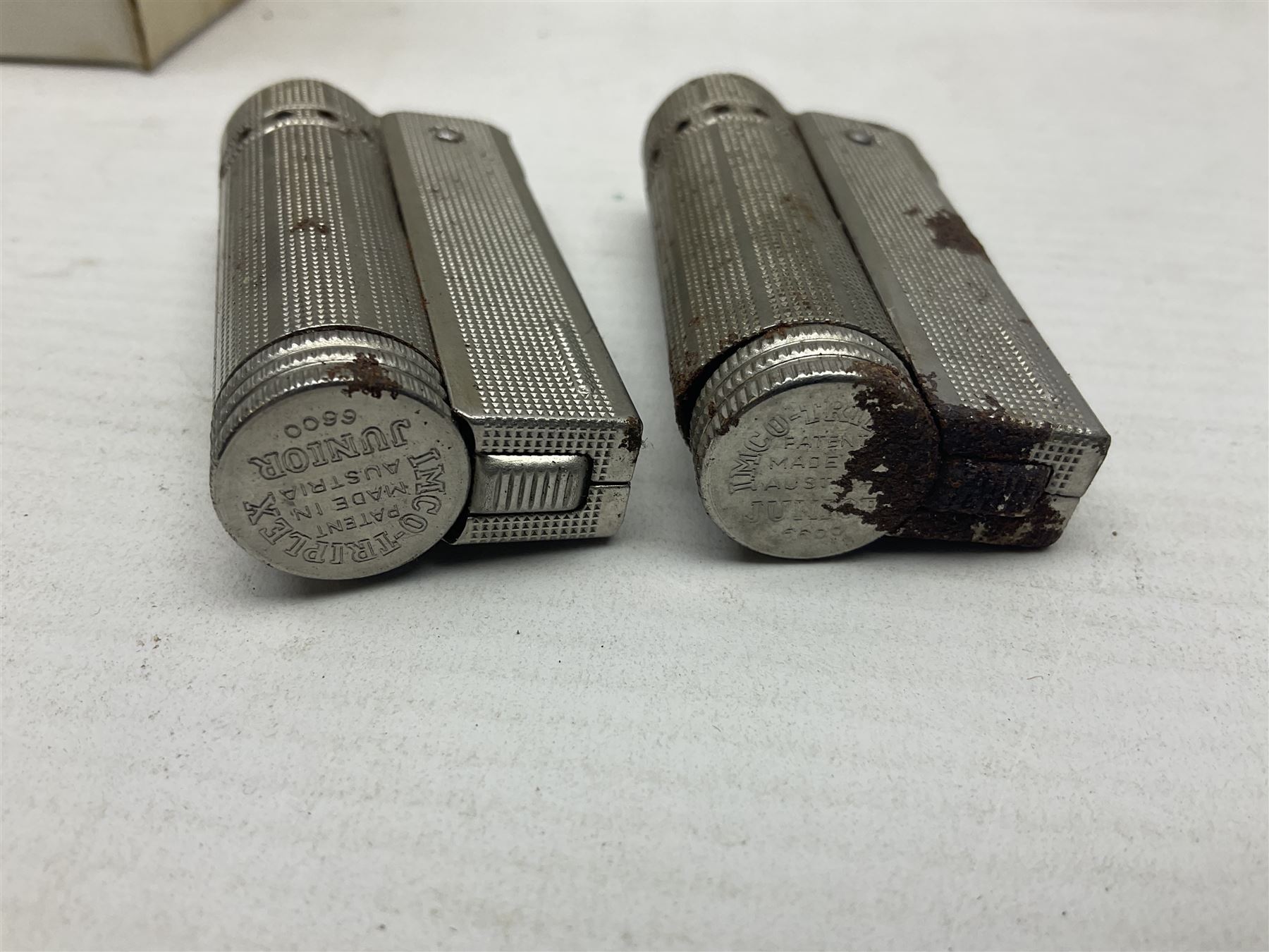 John Smiths presentation box commemorating 100 years of the Tadcaster brewery, containing two bottles of special brew and a glass, and a collection of lighters including Ronson and Jutson